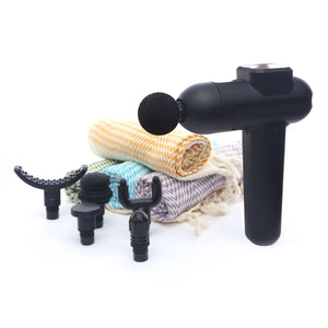 Black massage gun with attachments on a white background