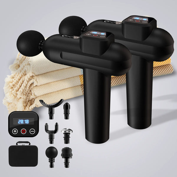 Black massage gun with attachments on a light gray background